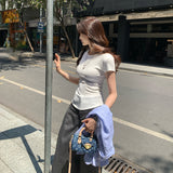 2026 Early Spring Temperament Korean Niche Round Collar Shoulder Short-Sleeved T-Shirt Female Commute Summer White Explosion