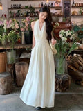 French Hanging Neck V-Neck Sleeveless Dress Women's Summer 2026 New Temperament To Receive The Waist Thin Hourglass Waist Long Skirt