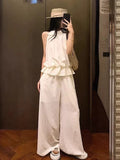 French Temperament Sleeveless Lotus Leaf Side Hanging Neck Vest Top Female Design Sense Loose Broad Legs Long Pants Set Summer