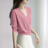 Short-Sleeved Ice Silk Knitted Women's 2026 Summer New Pearl Buckle Design Small Loose Thin Top