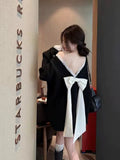 Black Bow With Bare Back V-Necked Sweater Women's Autumn/Winter 2026 New Lazy Wind High Sense Loose Knitting Top