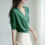 Short-Sleeved Ice Silk Knitted Women's 2026 Summer New Pearl Buckle Design Small Loose Thin Top
